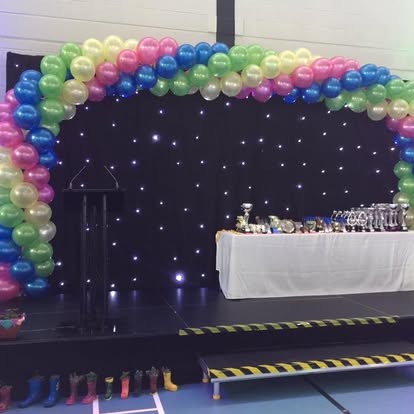 Starcloth backdrop with balloon arch and stage setup