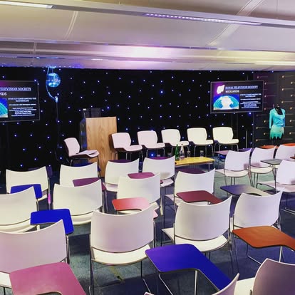 Conference seating with starcloth stage backdrop