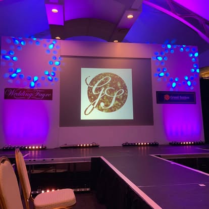Conference stage with catwalk extension and screen