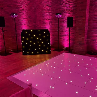 White starlight dance floor with pink uplighting