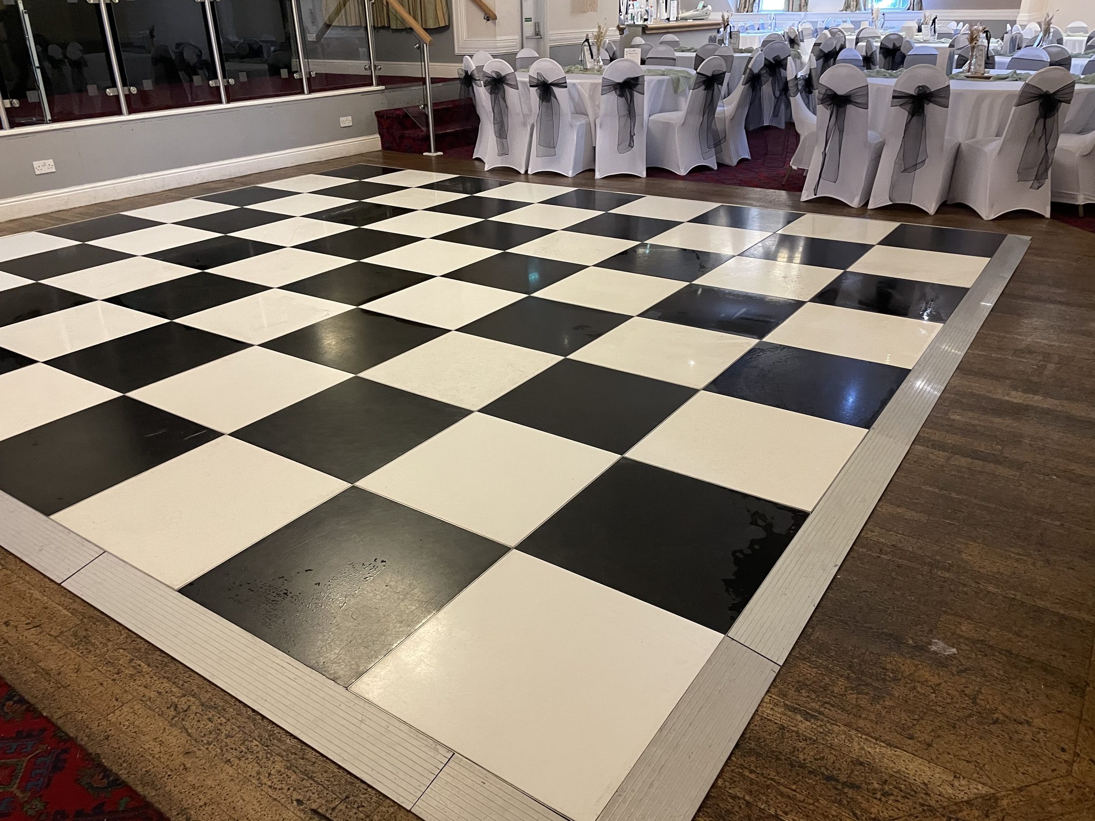 Close view of a black and white chequered dance floor