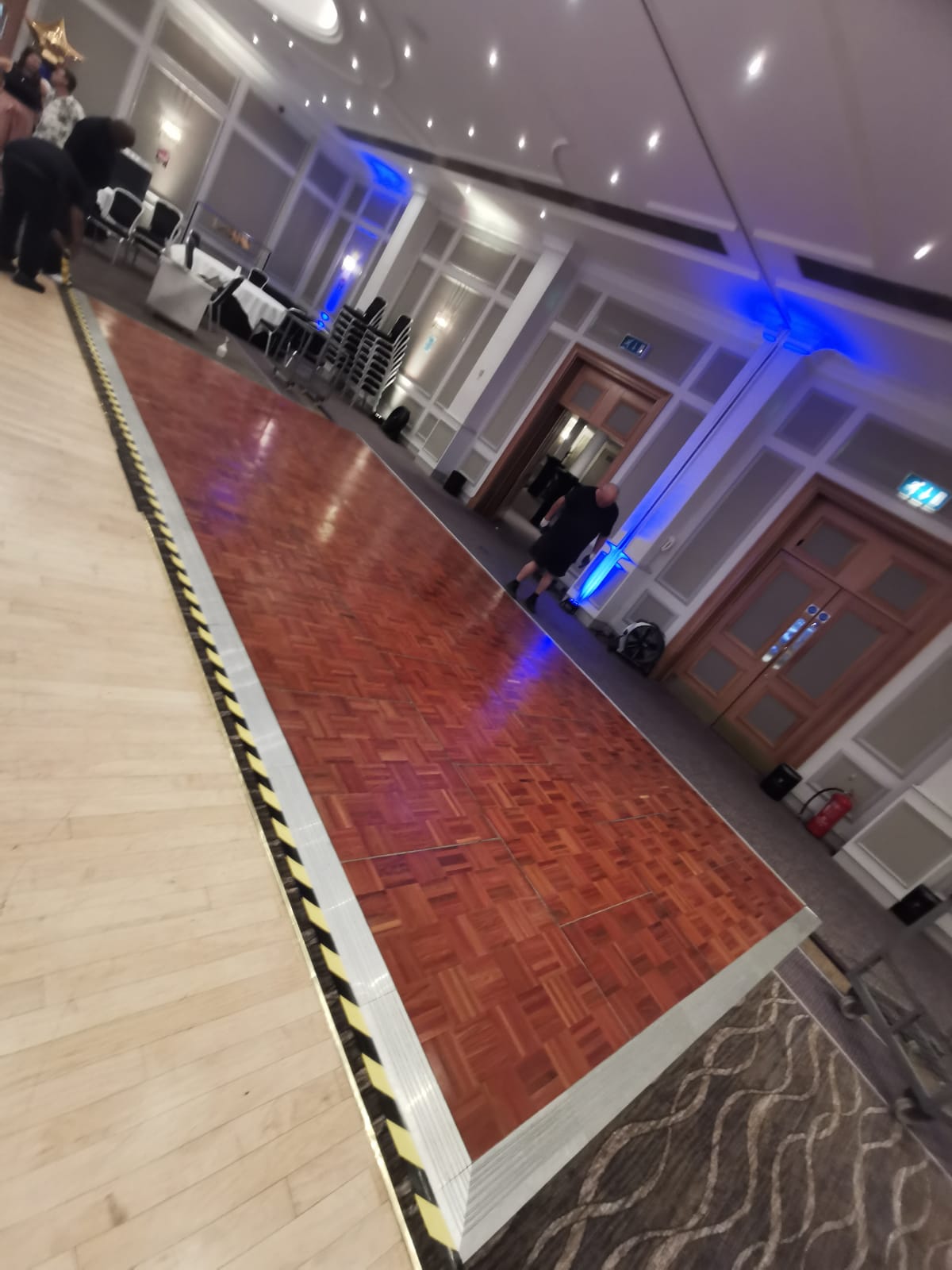 Parquet dance floor with blue uplighting