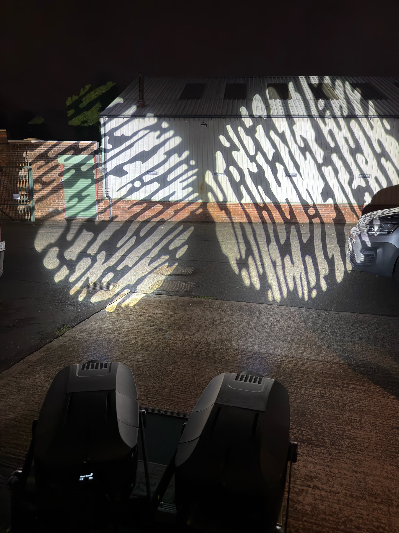 Black 400 watt gobo projectors testing a bright patterned image projection