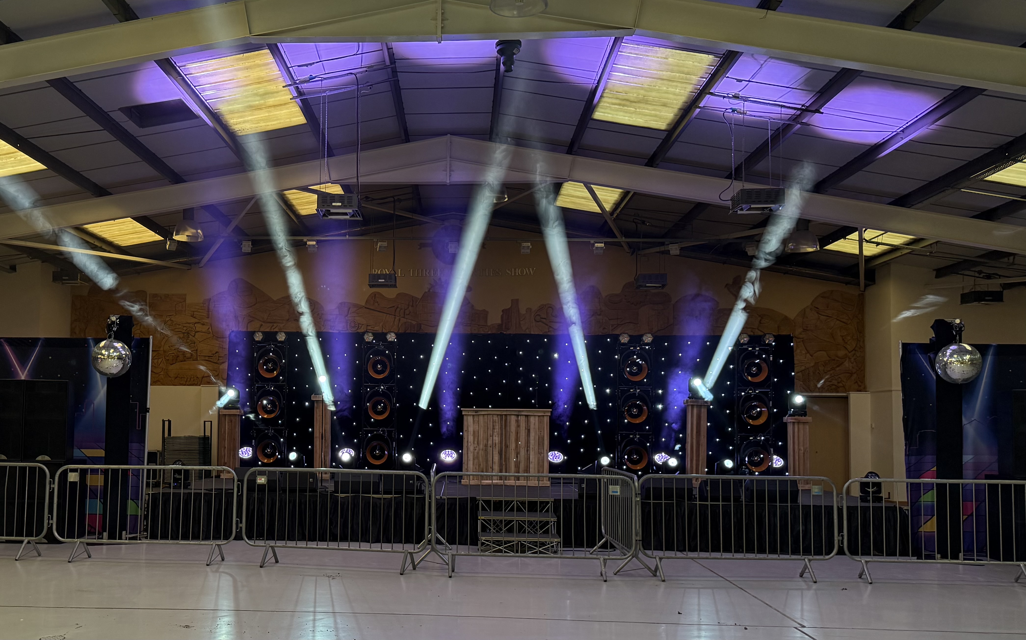 Wide Busfest lighting show setup at Three Counties Showground Malvern with moving beams and starlight backdrop