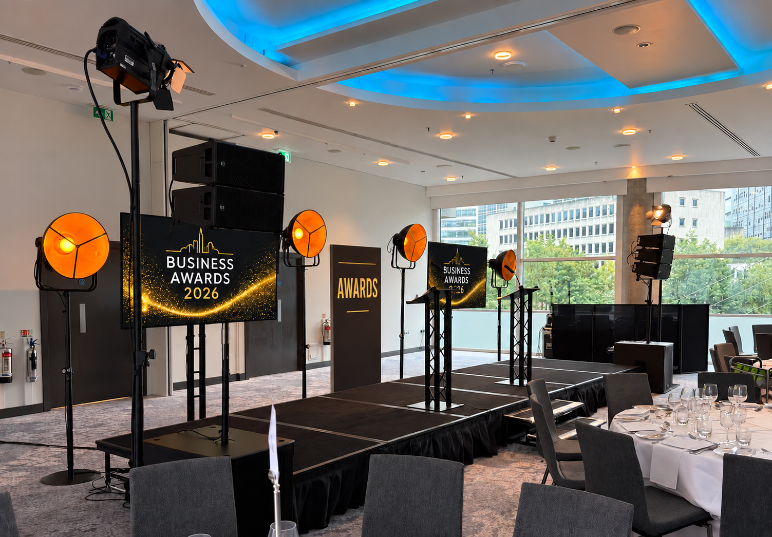 Business Awards 2026 stage, screens, PA system and warm event lighting supplied by Paul James Events