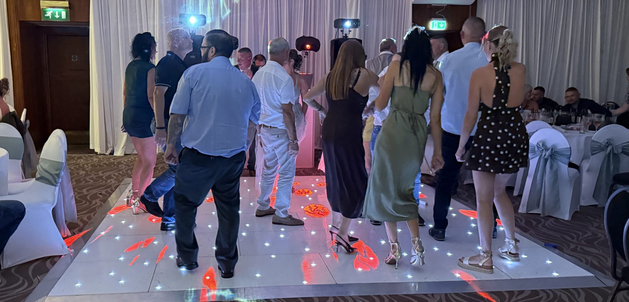 Wedding guests dancing on a white starlight dance floor at Copthorne Hotel Dudley