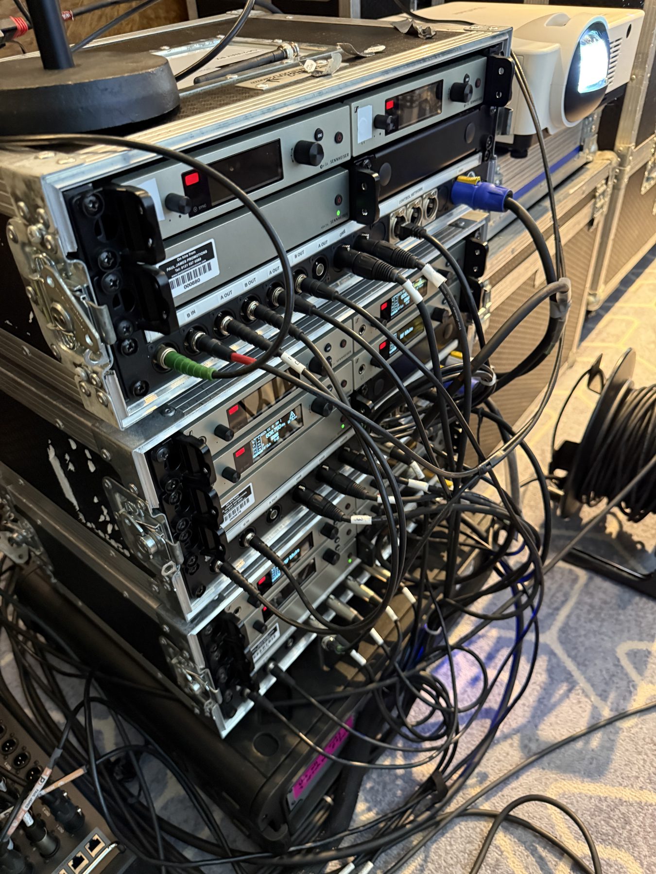 Professional wireless microphone and sound rack setup for a London conference