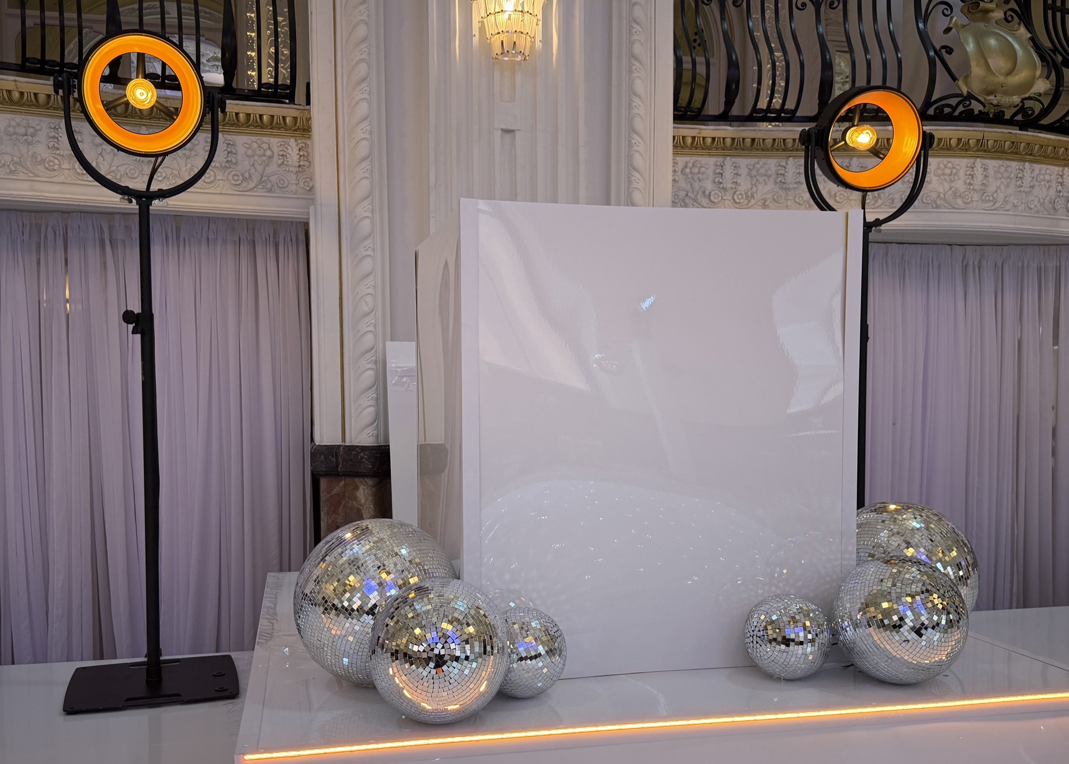 New Classique 40 lights and decorative mirror balls arranged around a white wedding stage