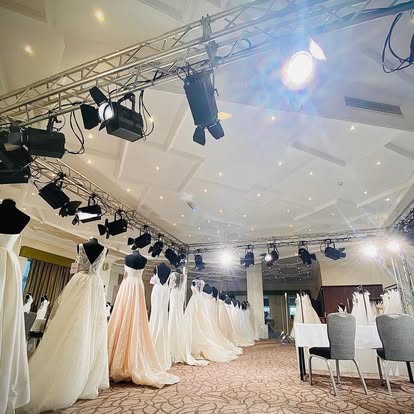 Fashion catwalk with dresses and lighting rig