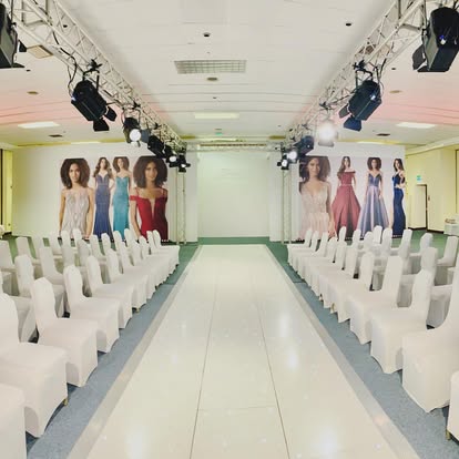 Fashion runway with seating and overhead lighting truss