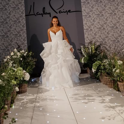 Bridal fashion show moment on a lit catwalk