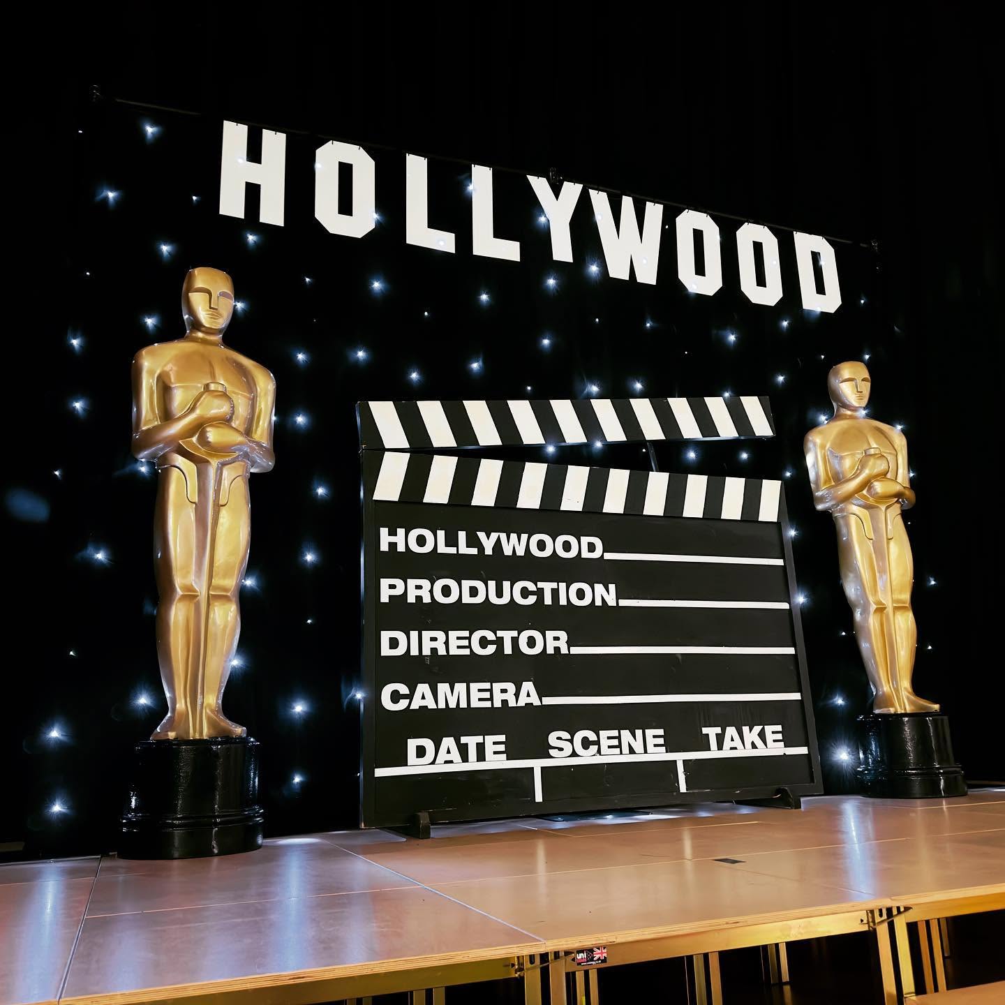 Hollywood awards night props with Oscar statues and clapper board