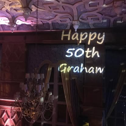 Birthday message image projection on a venue wall