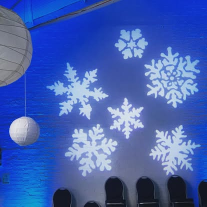 Snowflake gobo projection on a blue wall