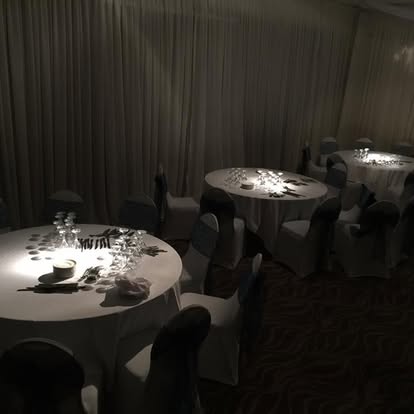 Table spotting lighting across dining tables