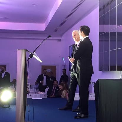 Lit lectern on an awards stage