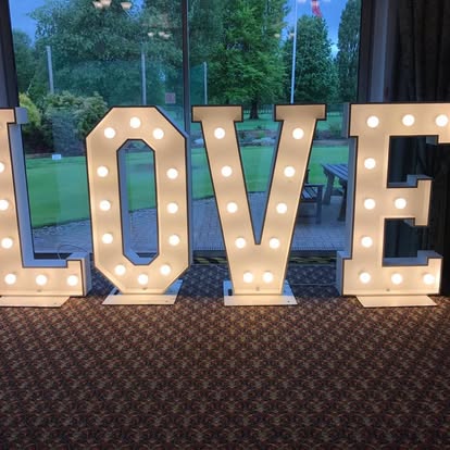 Large LOVE letters in front of windows