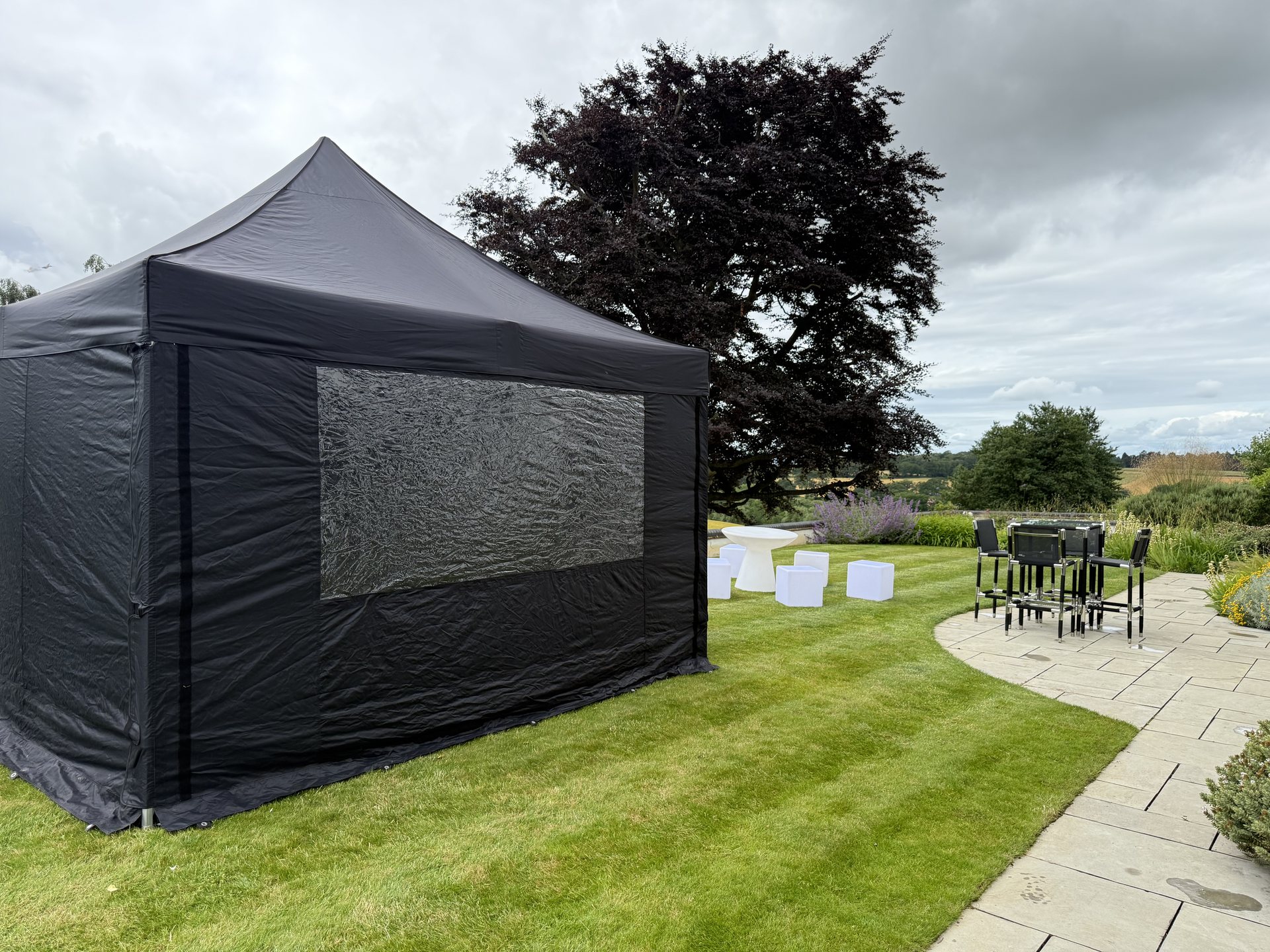 Marquee setup with LED furniture outdoors
