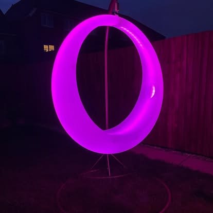 Pink illuminated ring feature with LED furniture styling