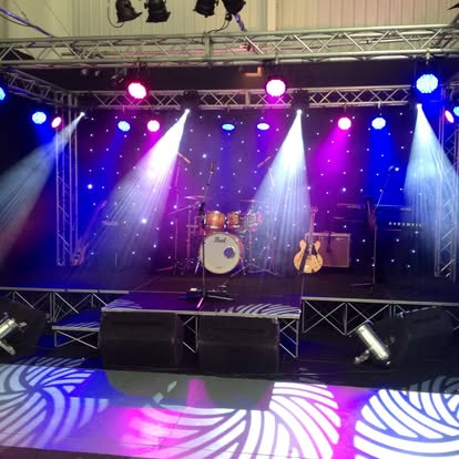 Stage set with starcloth and patterned dance floor lighting