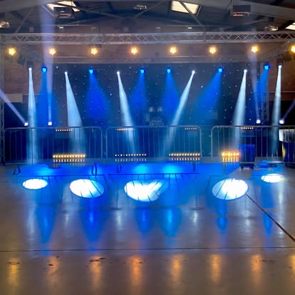 Blue stage lighting setup in an event hall