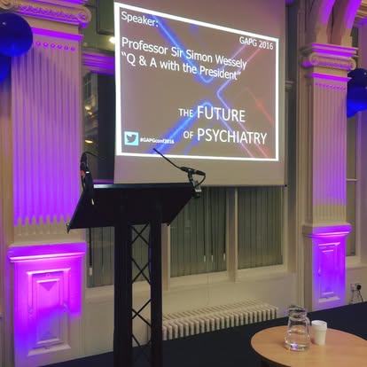 Lectern and screen setup for a small talk event