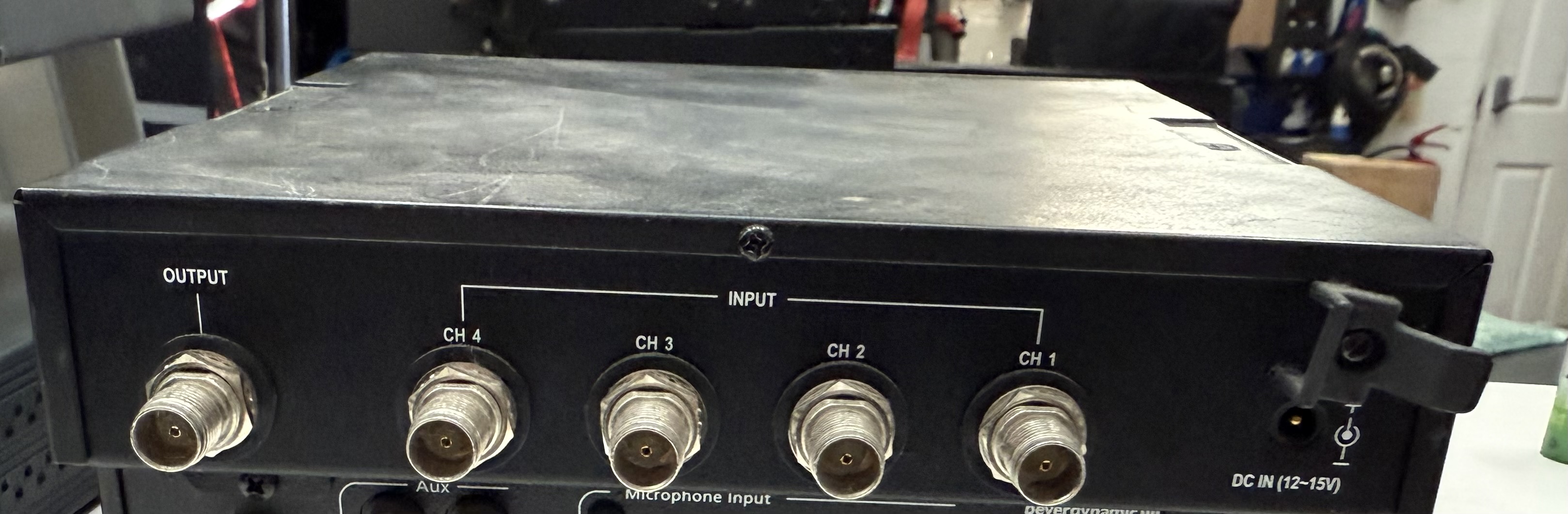 Rear connections of the MIPRO AD-808 showing four TNC transmitter inputs, one antenna output and DC power input