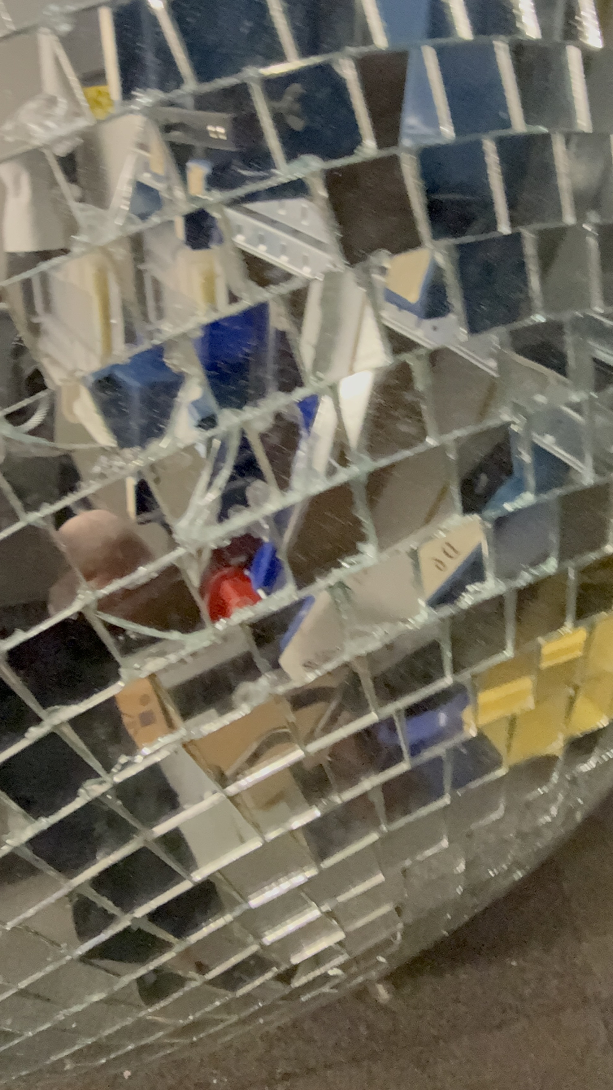 Close-up of the reflective tiles on a 60cm mirror ball