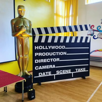 Hollywood clapboard and Oscar prop display