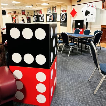 Giant dice props in a themed room