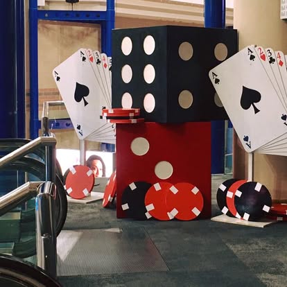 Casino props with giant dice and cards on display