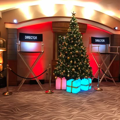 Director chair props beside Christmas styling