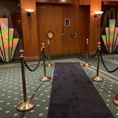 VIP rope entrance with themed prop panels
