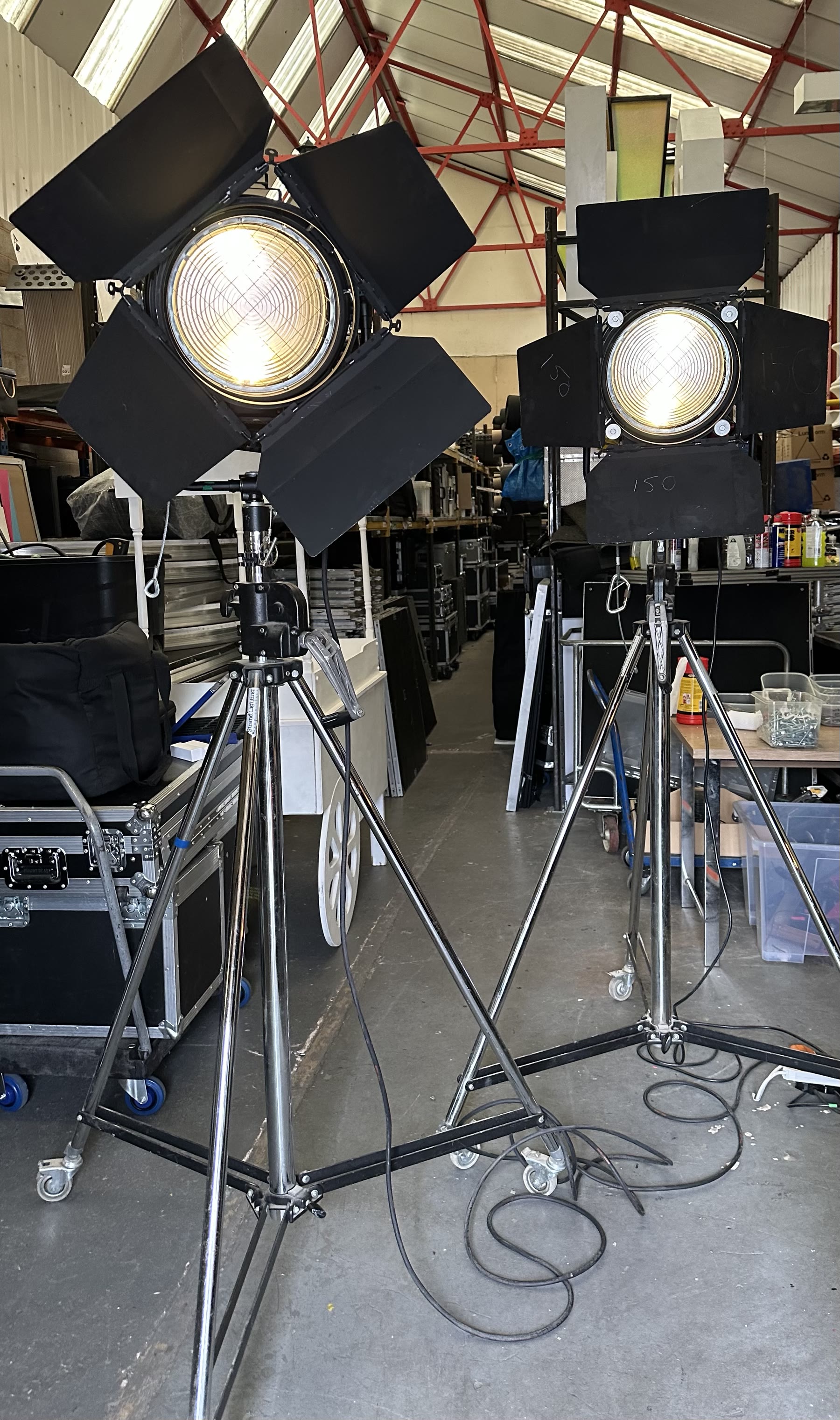 Pair of vintage Hollywood movie studio spotlight props on chrome stands