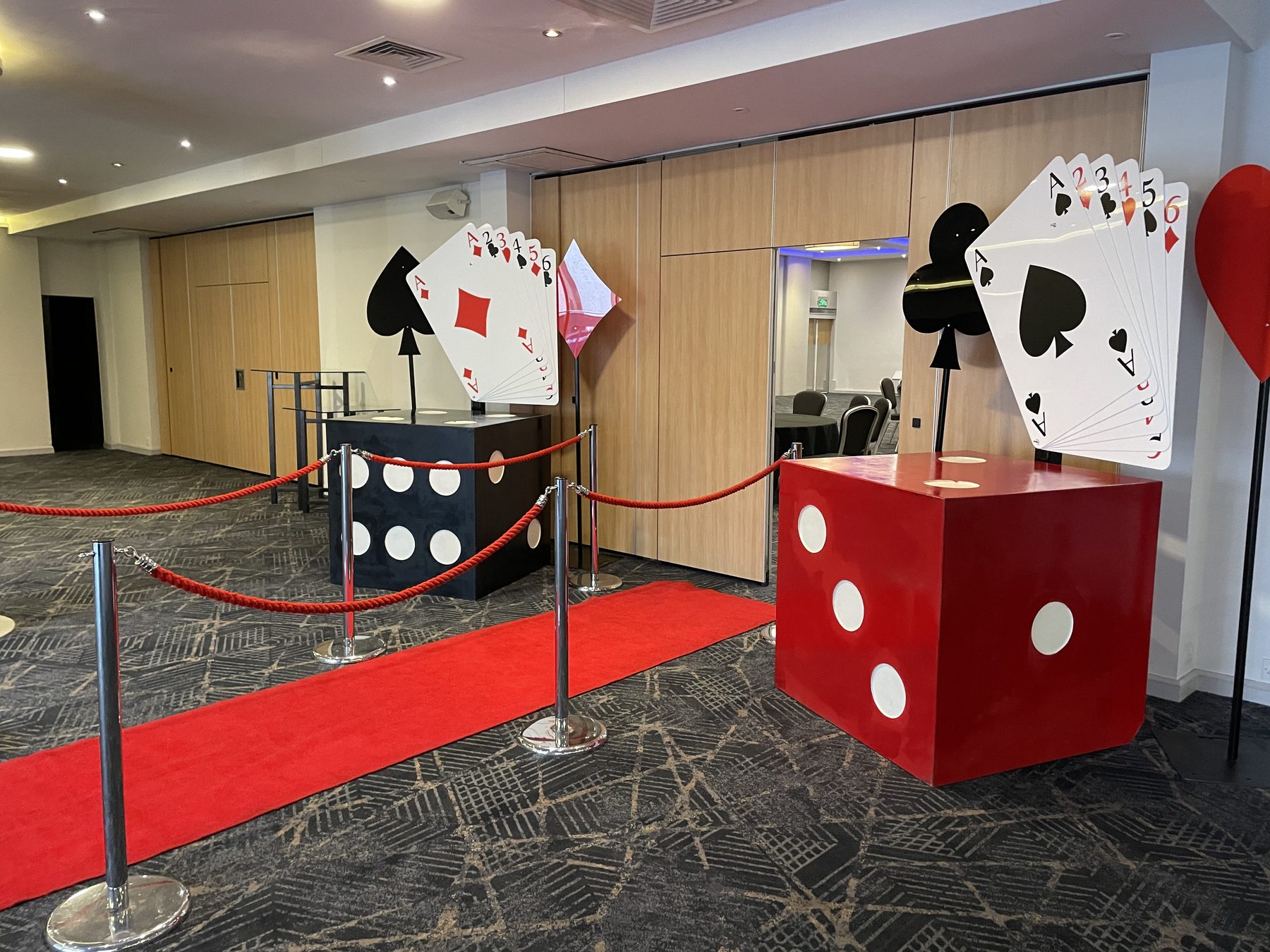 Casino and Las Vegas themed props with giant dice, playing cards and red carpet in Birmingham