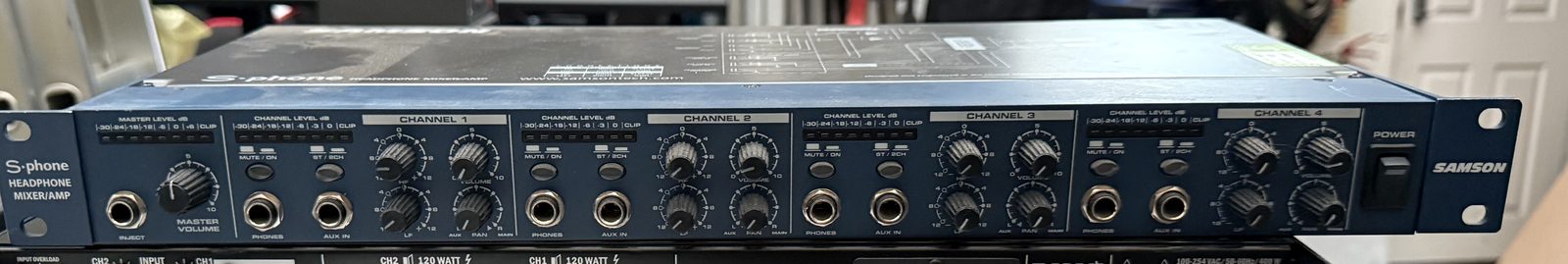 Front panel of a used Samson S-phone four-channel rackmount headphone mixer and amplifier
