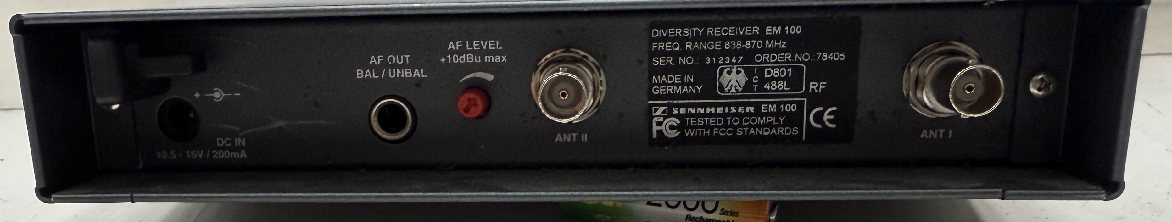 Rear view of the Sennheiser EM 100 receiver showing antenna sockets, audio output and 838 to 870 MHz frequency label