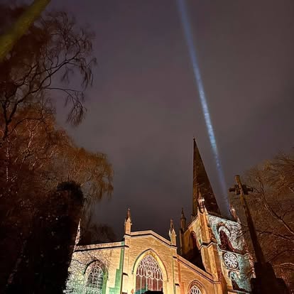 Sky beam lighting above a church