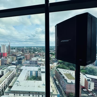 Speaker in a high-rise venue space