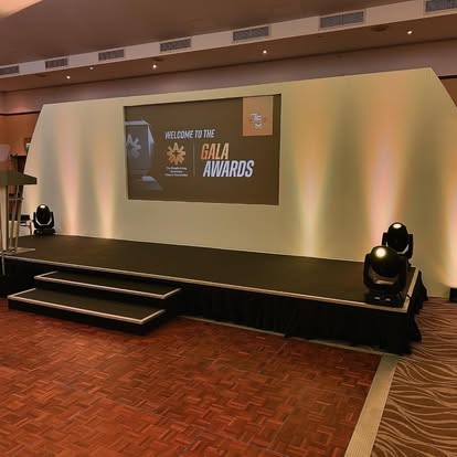 Awards stage with steps and lit backdrop