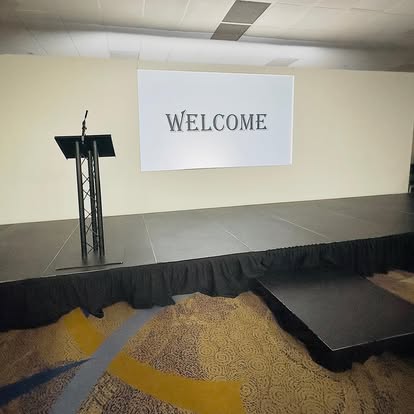 Stage with lectern and catwalk extension