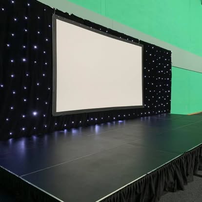 Stage with projection screen and starcloth backdrop