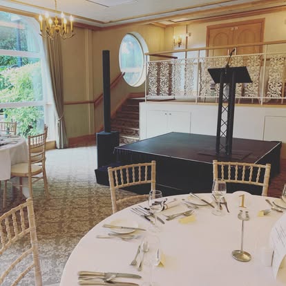 Compact stage with lectern in a banqueting room