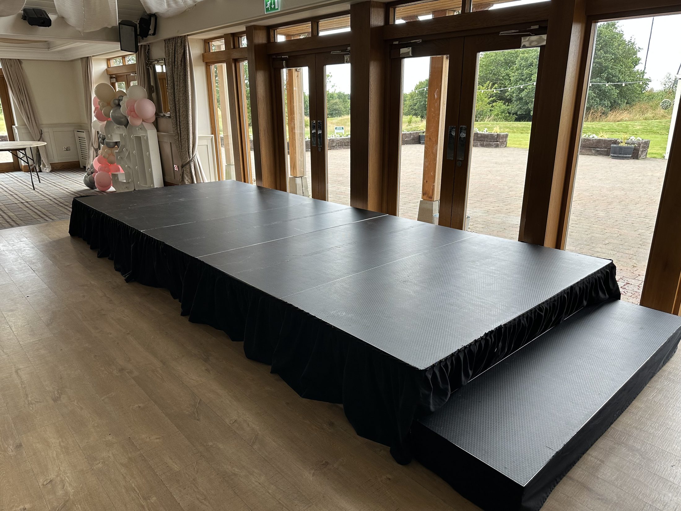 Black modular stage with matching step section