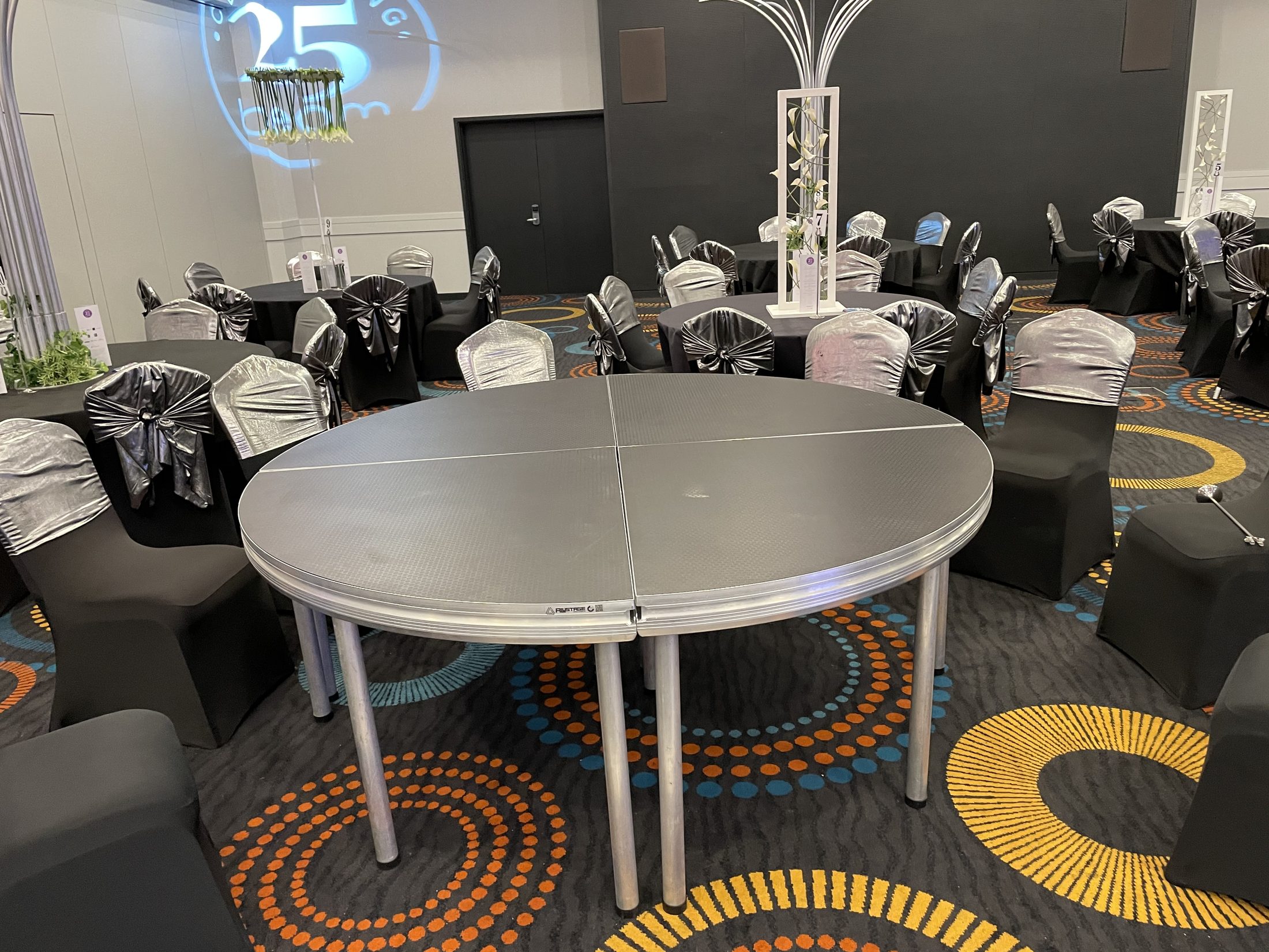 Round modular stage in a decorated event room