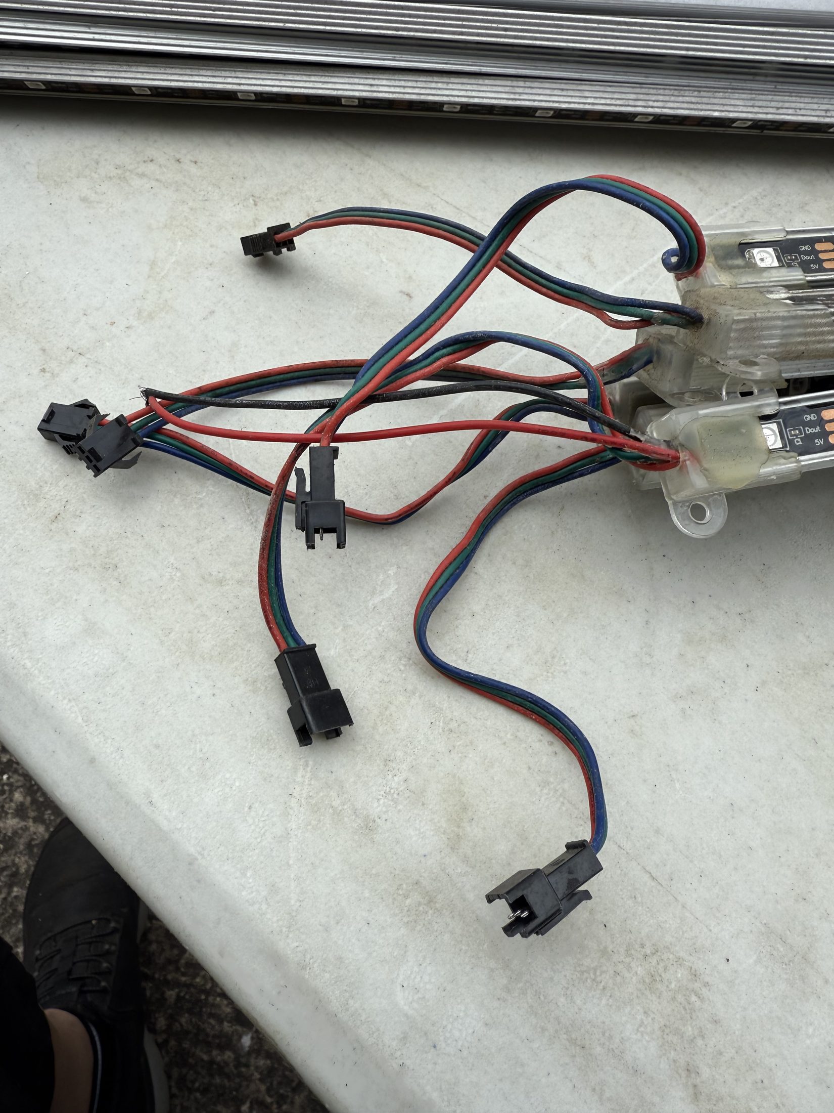 Wiring and plug-in connectors on used addressable RGB LED strip bar sections