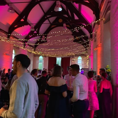 Pink wall wash lighting in a party venue