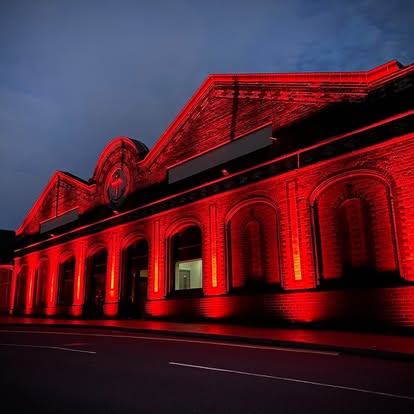 Red exterior architectural lighting on a building