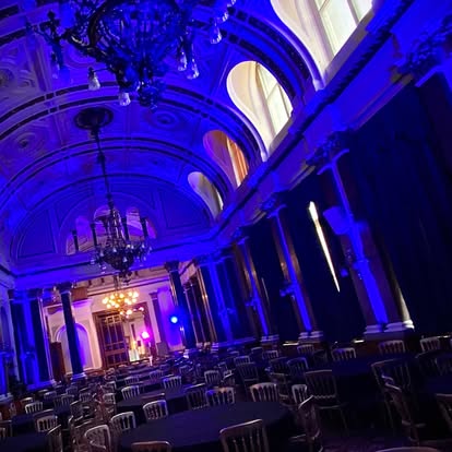 Blue uplighting in a grand hall